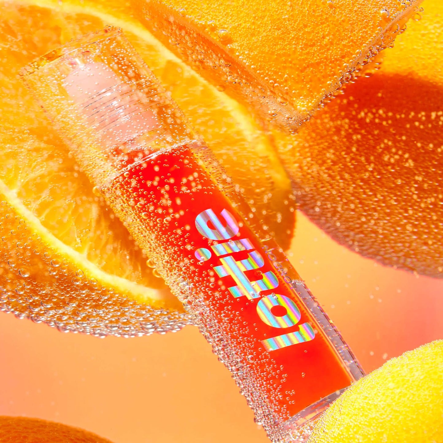 Lottie London Roller Glaze in O.J., color changing nourishing lip oil which adapts to the natural pH in your lips Beauty and Personal Care Lottie London