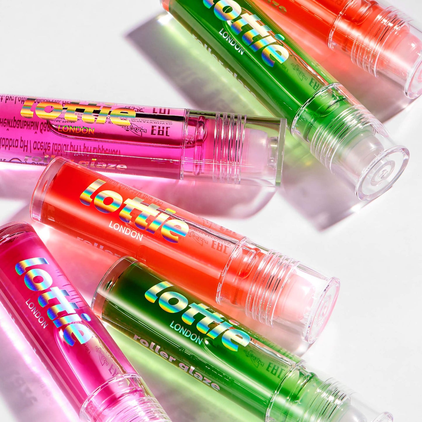 Lottie London Roller Glaze in O.J., color changing nourishing lip oil which adapts to the natural pH in your lips Beauty and Personal Care Lottie London