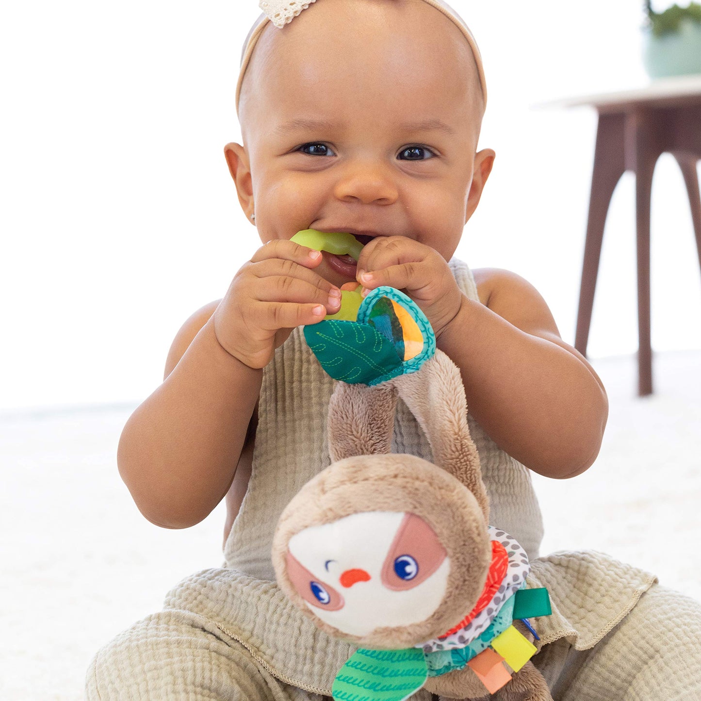 Infantino Music & Motion Pulldown Sloth - Musical Plush Sloth with Multi-Textured teether for Tactile Exploration, Easily attaches to Strollers and…