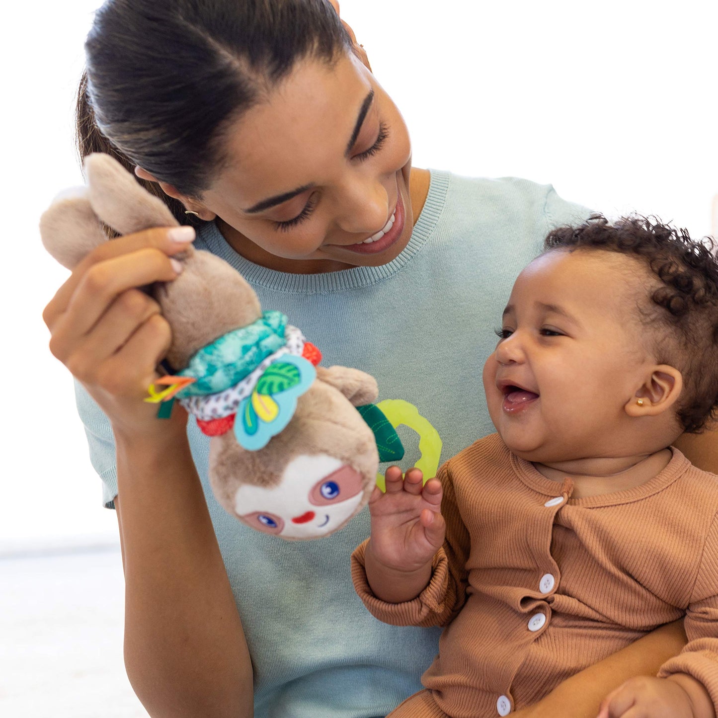 Infantino Music & Motion Pulldown Sloth - Musical Plush Sloth with Multi-Textured teether for Tactile Exploration, Easily attaches to Strollers and…