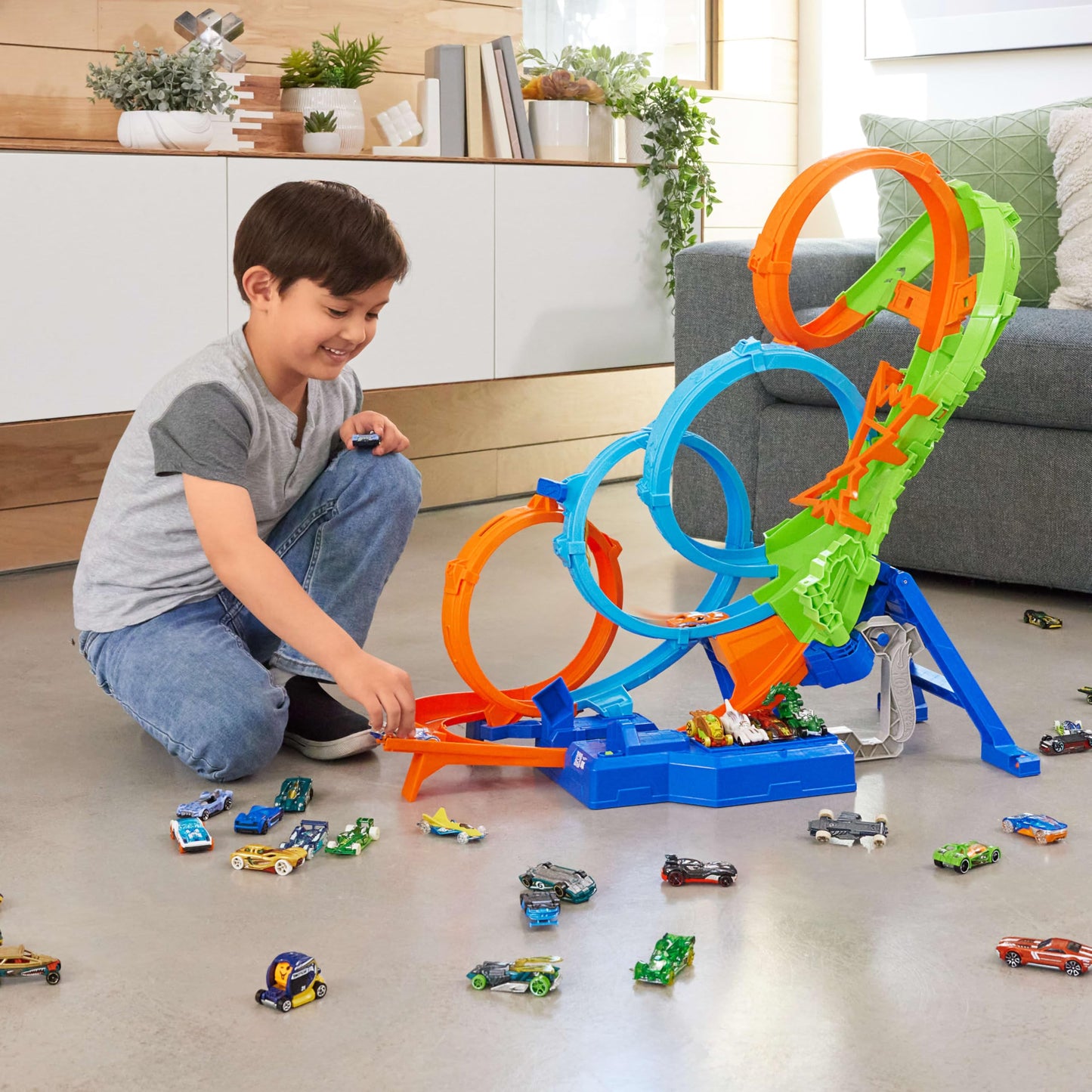 Hot Wheels Track Set with 4 Loops, 3-Way Crash Zone & Motorized Booster, Folds for Storage, with 1:64 Scale Toy Car