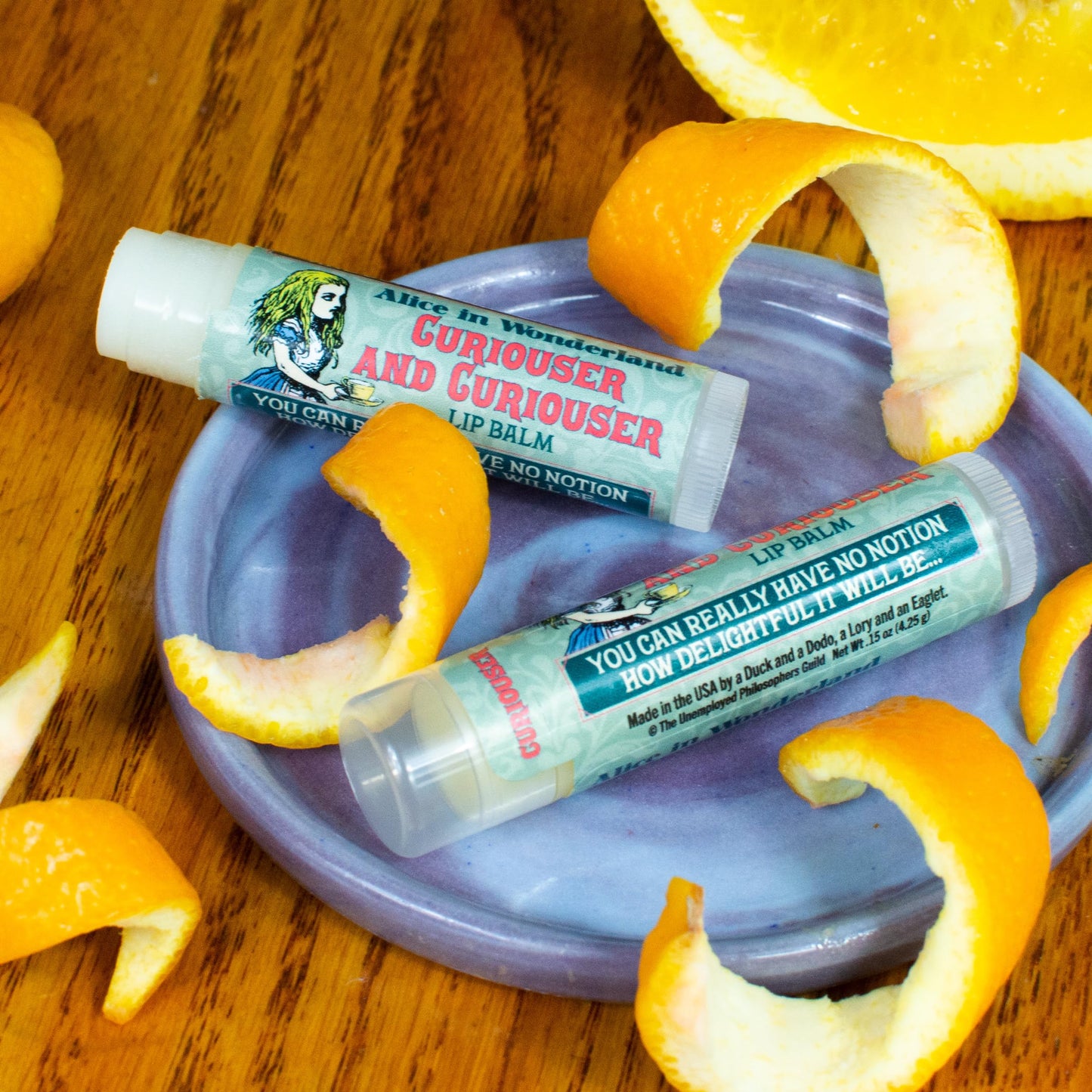 The Unemployed Philosophers Guild Alice in Wonderland Curioser and Curioser Lip Balm - Orange Marmalade Flavored, Cruelty-Free, Made in the USA